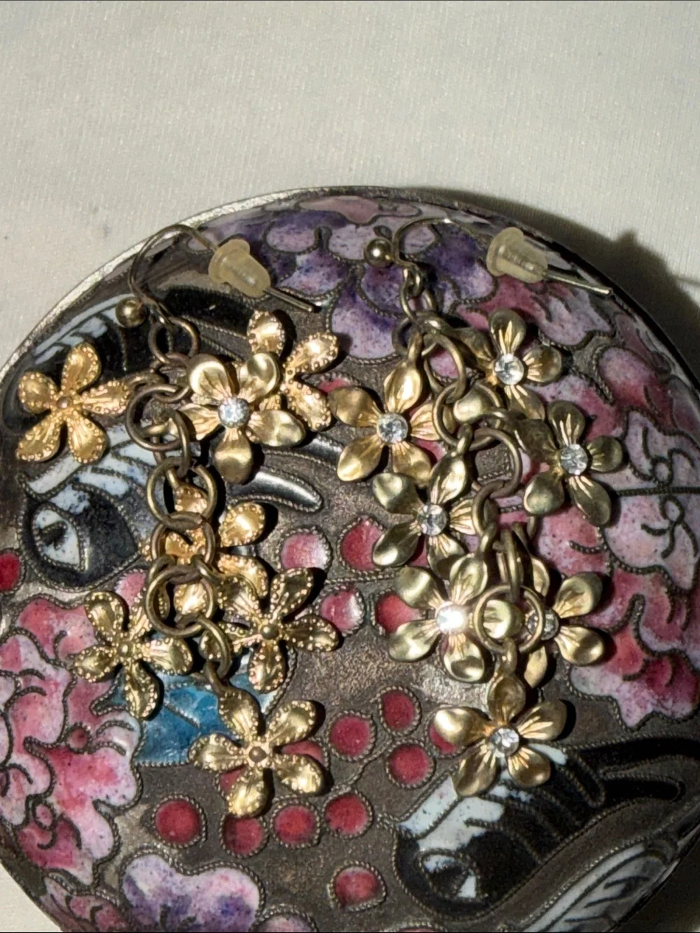 Gold Floral Dangle Earrings with Crystal Centers